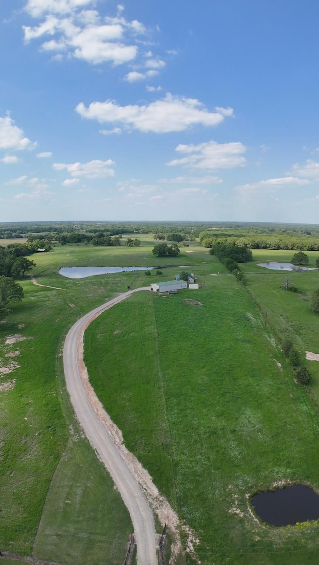 aerial view with a rural view and a water view