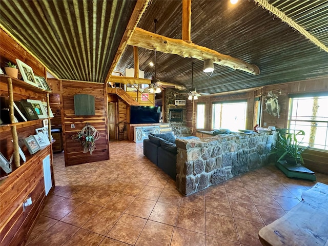 tiled living room with wood ceiling, wooden walls, lofted ceiling, and a ceiling fan