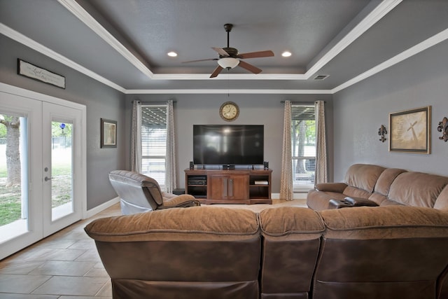 184 Wildflower Trl, Weatherford, TX 76087 - living room with a raised ceiling, a healthy amount of sunlight, ceiling fan, and visible vents