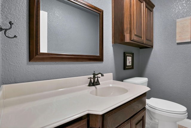 184 Wildflower Trl, Weatherford, TX 76087 - bathroom with a textured wall, toilet, and vanity