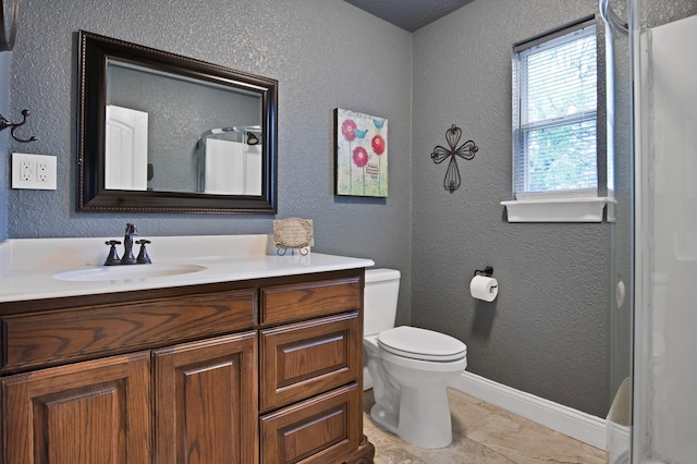 184 Wildflower Trl, Weatherford, TX 76087 - bathroom featuring baseboards, a textured wall, toilet, and vanity