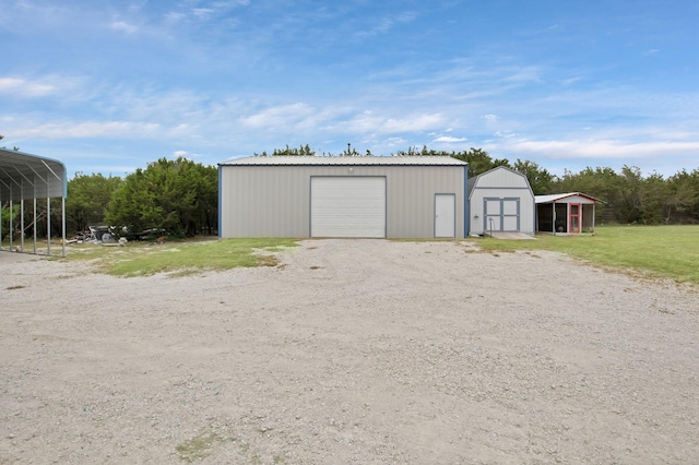 184 Wildflower Trl, Weatherford, TX 76087 - detached garage with a storage unit and driveway