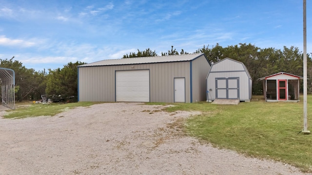 184 Wildflower Trl, Weatherford, TX 76087 - detached garage with driveway and a shed