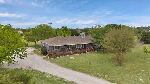 184 Wildflower Trl, Weatherford, TX 76087 - exterior space featuring dirt driveway, a chimney, covered porch, and a front yard