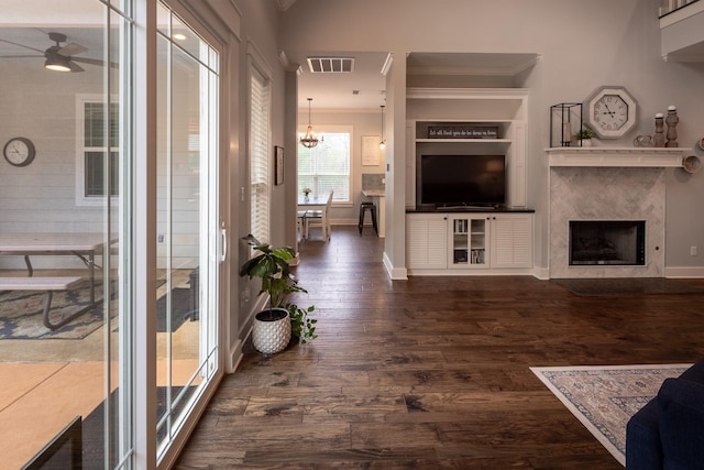 3050 County Road 3707, Bullard, TX 75757 - living area featuring ornamental molding, dark wood-type flooring, baseboards, a high end fireplace, and ceiling fan
