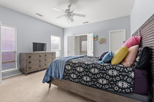 bedroom featuring ceiling fan, carpet floors, and visible vents