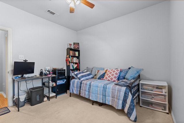 bedroom featuring baseboards, a ceiling fan, visible vents, and carpet