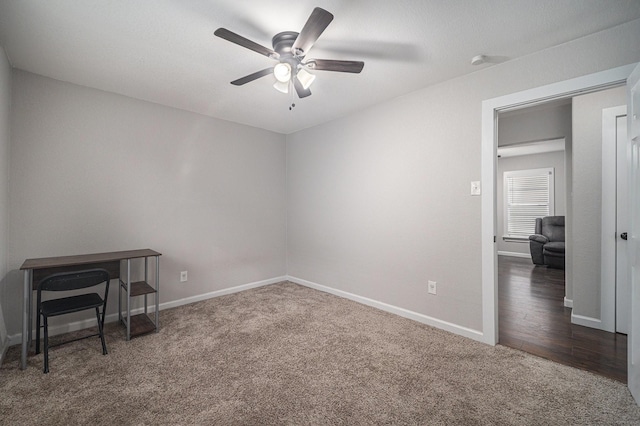 unfurnished bedroom featuring baseboards, a ceiling fan, and carpet flooring