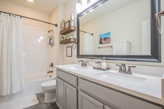 full bathroom with shower / bath combination with curtain, double vanity, toilet, and a sink