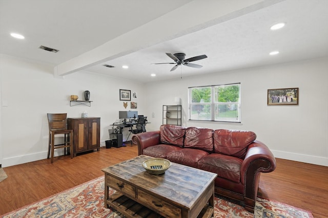 living area with visible vents, recessed lighting, baseboards, and wood finished floors