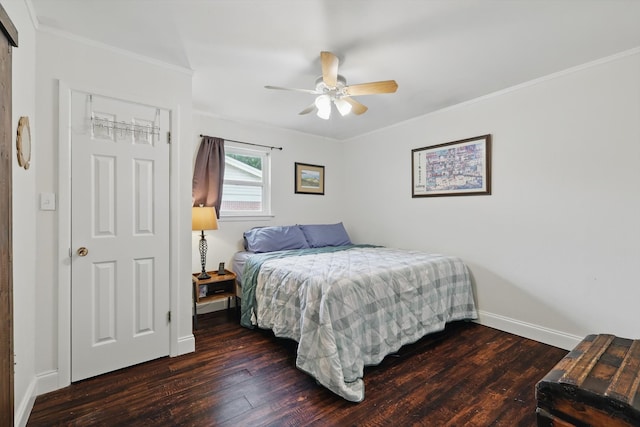 bedroom with a ceiling fan, baseboards, ornamental molding, and wood finished floors