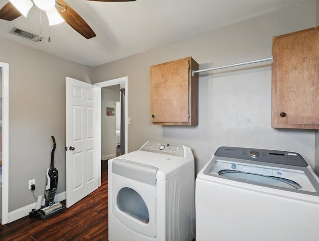 laundry area with a ceiling fan, dark wood-style flooring, visible vents, cabinet space, and washer and clothes dryer