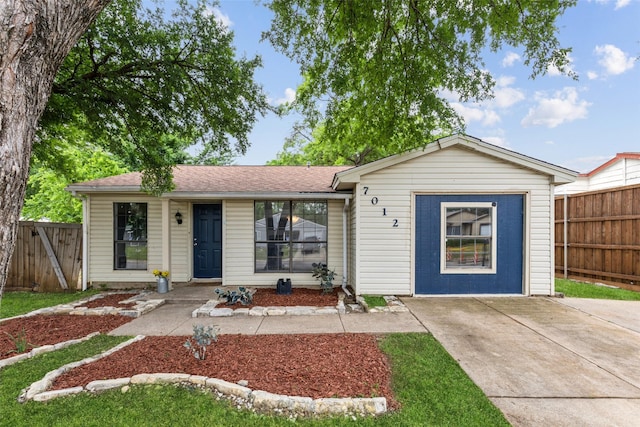 single story home with fence and roof with shingles
