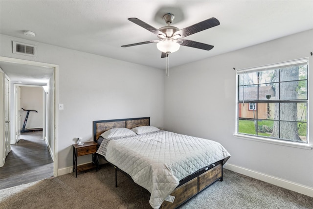 7012 Newberry Ct E, Fort Worth, TX 76120 - bedroom featuring carpet flooring, visible vents, baseboards, and a ceiling fan