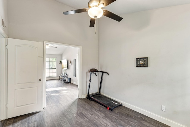 7012 Newberry Ct E, Fort Worth, TX 76120 - workout area featuring ceiling fan, a towering ceiling, baseboards, and dark wood finished floors