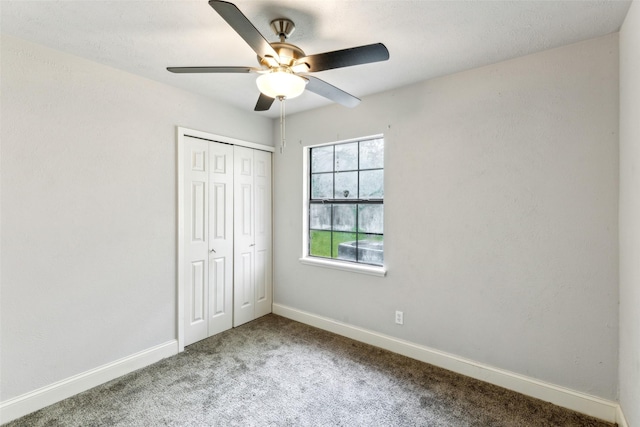 7012 Newberry Ct E, Fort Worth, TX 76120 - unfurnished bedroom featuring carpet flooring, a closet, baseboards, and ceiling fan
