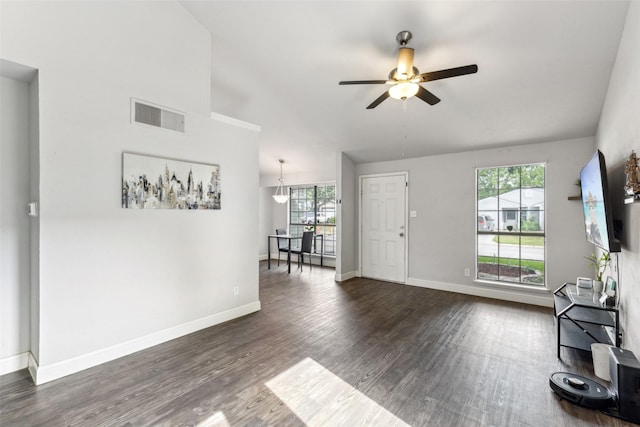 7012 Newberry Ct E, Fort Worth, TX 76120 - living room featuring a wealth of natural light, ceiling fan, dark wood finished floors, and visible vents