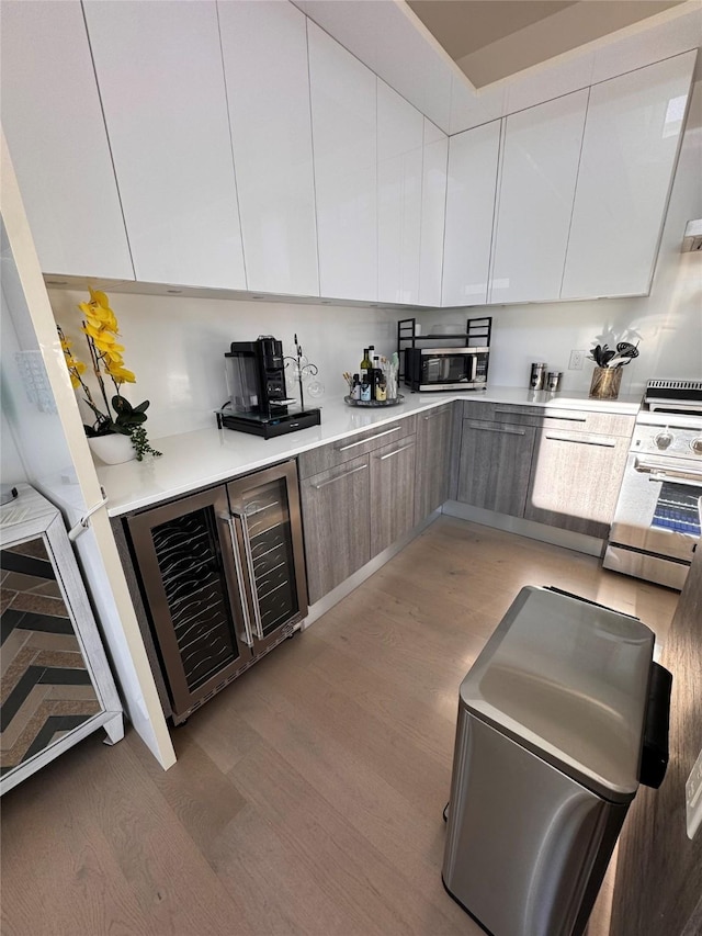3923 Cole Ave Unit 303, Dallas, TX 75204 - kitchen with stainless steel appliances, beverage cooler, and modern cabinets