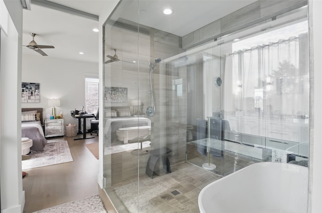 3923 Cole Ave Unit 303, Dallas, TX 75204 - ensuite bathroom with a ceiling fan, a stall shower, a soaking tub, ensuite bath, and recessed lighting