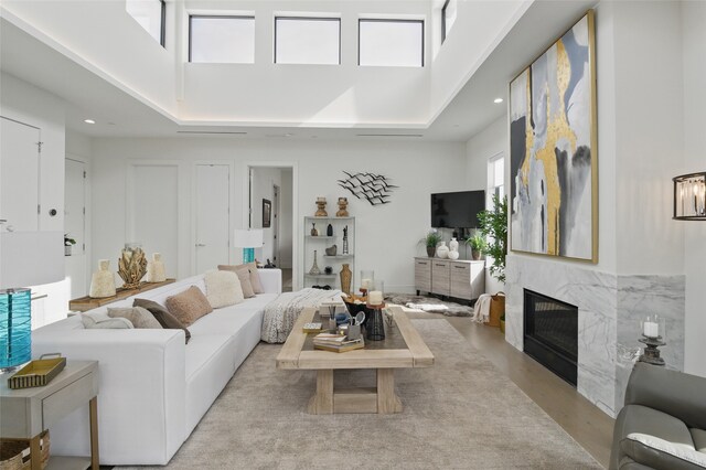 3923 Cole Ave Unit 303, Dallas, TX 75204 - living area featuring a towering ceiling, a fireplace, and recessed lighting