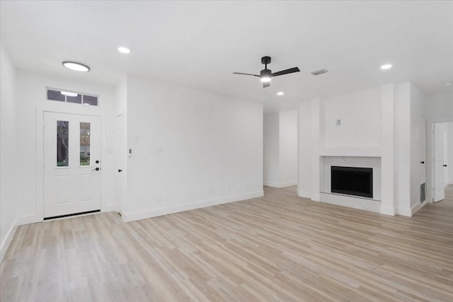 1941 Juniper Dr, Little Elm, TX 75068 - unfurnished living room featuring ceiling fan, light wood-type flooring, baseboards, recessed lighting, and a fireplace