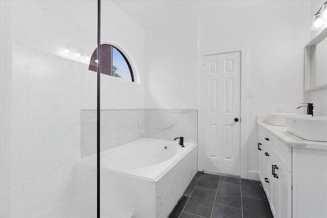 1941 Juniper Dr, Little Elm, TX 75068 - full bathroom with vanity, a garden tub, and tile patterned floors