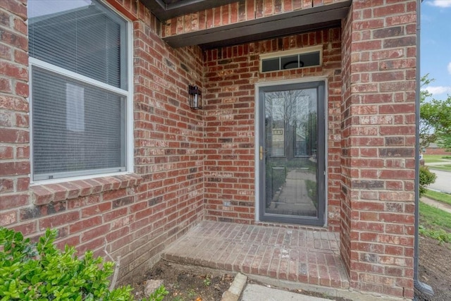 1941 Juniper Dr, Little Elm, TX 75068 - doorway to property with brick siding