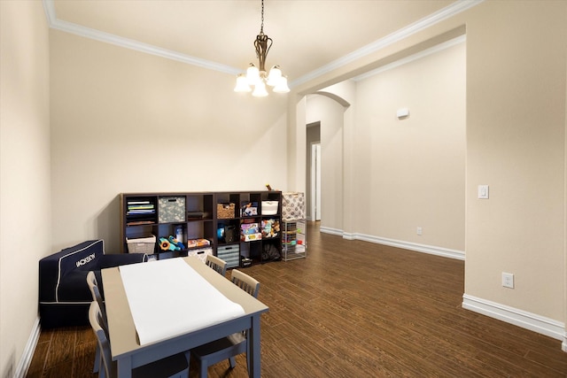 home office featuring arched walkways, baseboards, an inviting chandelier, wood finished floors, and ornamental molding