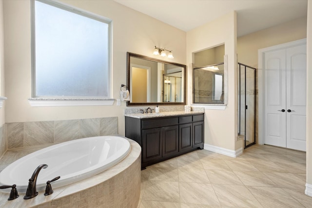 bathroom featuring a garden tub, vanity, tile patterned flooring, and a stall shower