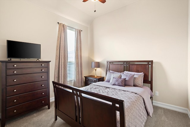 carpeted bedroom featuring vaulted ceiling, baseboards, and ceiling fan