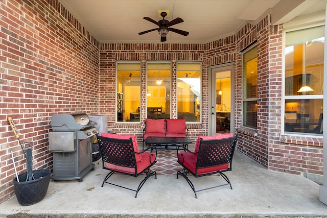 view of patio with an outdoor living space, a ceiling fan, and a grill