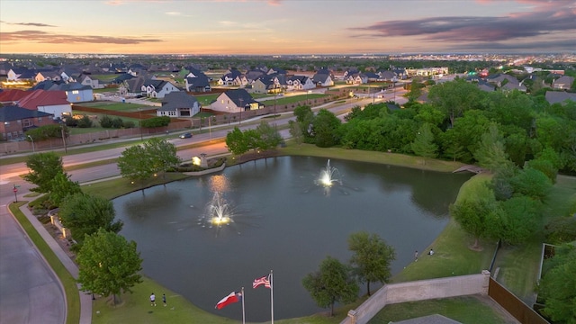 aerial view with a residential view and a water view