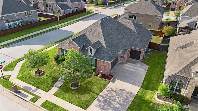 birds eye view of property with a residential view