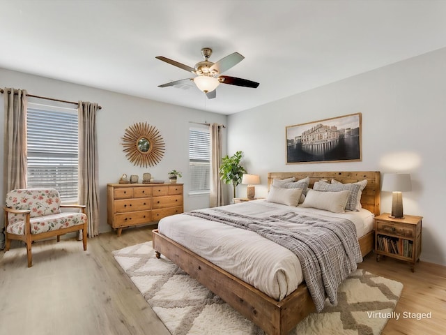 bedroom featuring ceiling fan and light wood finished floors