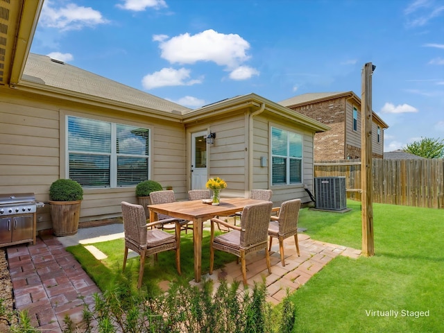 view of patio featuring cooling unit, a grill, outdoor dining area, and fence