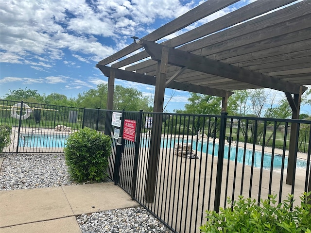 view of gate featuring a community pool, a pergola, and fence
