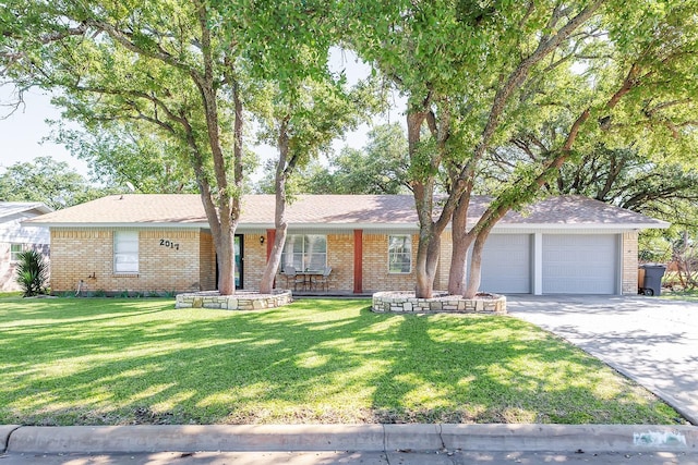 ranch-style house featuring a garage, driveway, covered porch, a front yard, and brick siding