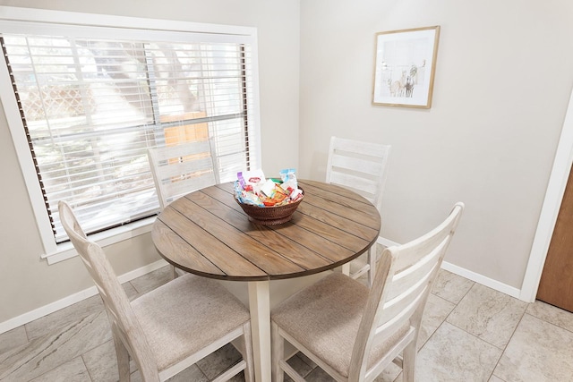 dining room featuring baseboards