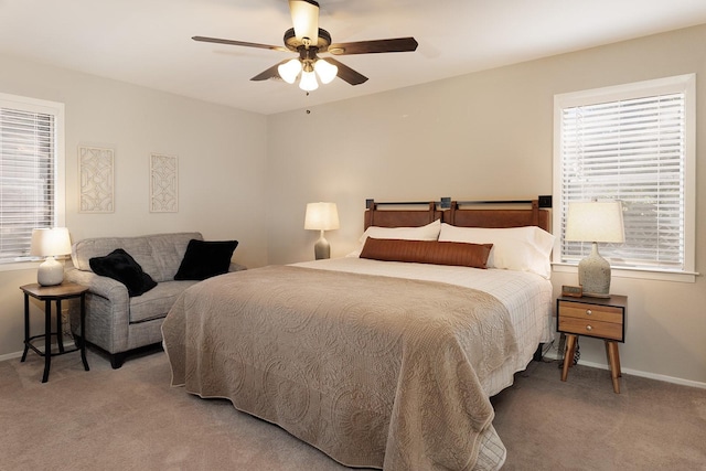 bedroom with baseboards, light colored carpet, and ceiling fan