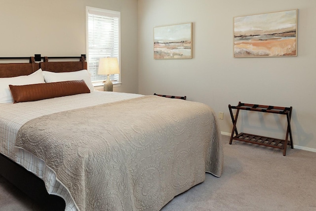 carpeted bedroom with baseboards