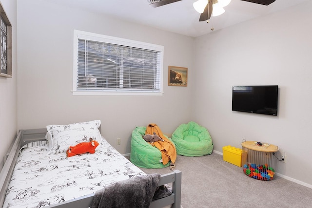 bedroom with a ceiling fan, baseboards, and carpet floors