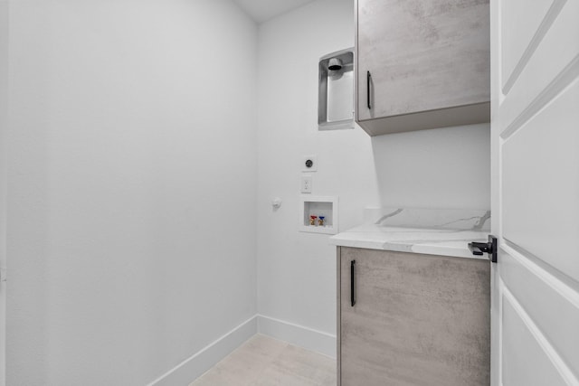 1926 Pueblo St, Dallas, TX 75212 - clothes washing area with baseboards, hookup for a washing machine, electric dryer hookup, and cabinet space
