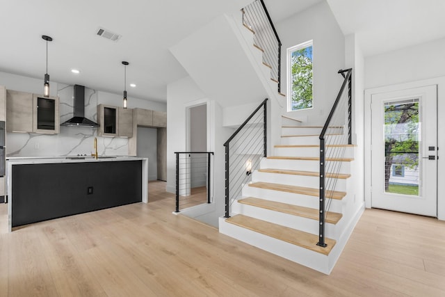 1926 Pueblo St, Dallas, TX 75212 - staircase featuring visible vents, plenty of natural light, and wood finished floors