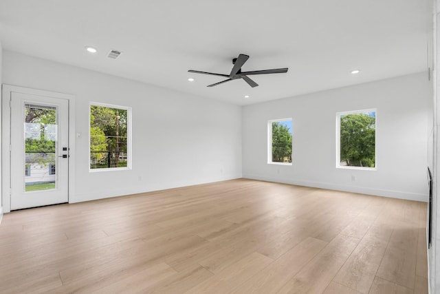 1926 Pueblo St, Dallas, TX 75212 - unfurnished room featuring light wood-style flooring, ceiling fan, and a wealth of natural light