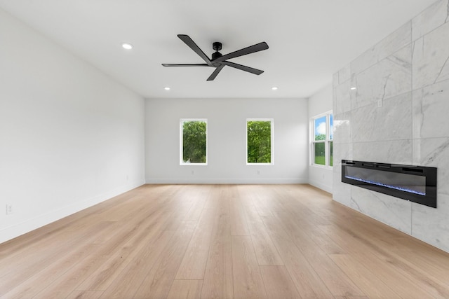 1926 Pueblo St, Dallas, TX 75212 - unfurnished living room with baseboards, recessed lighting, a tiled fireplace, a ceiling fan, and light wood-style flooring