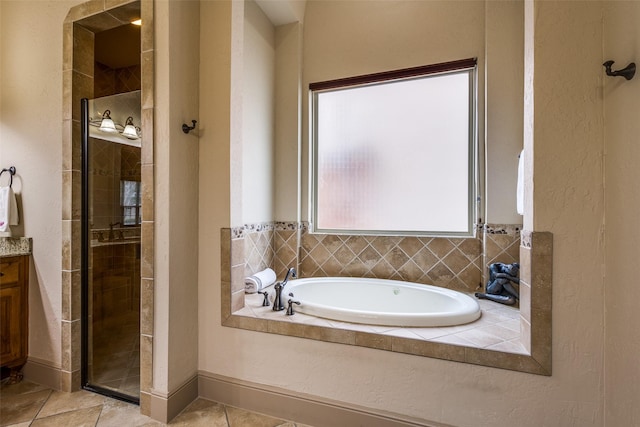 4312 Blue Quail Dr, Mckinney, TX 75072 - full bath with a stall shower, a garden tub, tile patterned flooring, and vanity