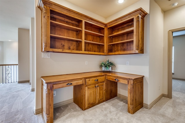 4312 Blue Quail Dr, Mckinney, TX 75072 - unfurnished office featuring light colored carpet, built in desk, and baseboards