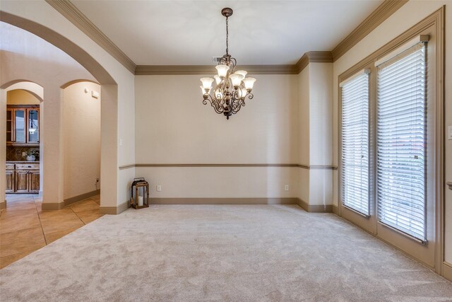 4312 Blue Quail Dr, Mckinney, TX 75072 - empty room with light colored carpet, ornamental molding, arched walkways, a chandelier, and baseboards