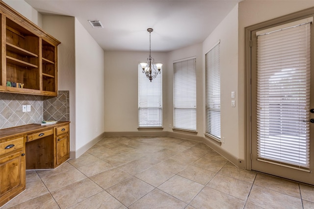 4312 Blue Quail Dr, Mckinney, TX 75072 - unfurnished dining area featuring a chandelier, light tile patterned flooring, and baseboards