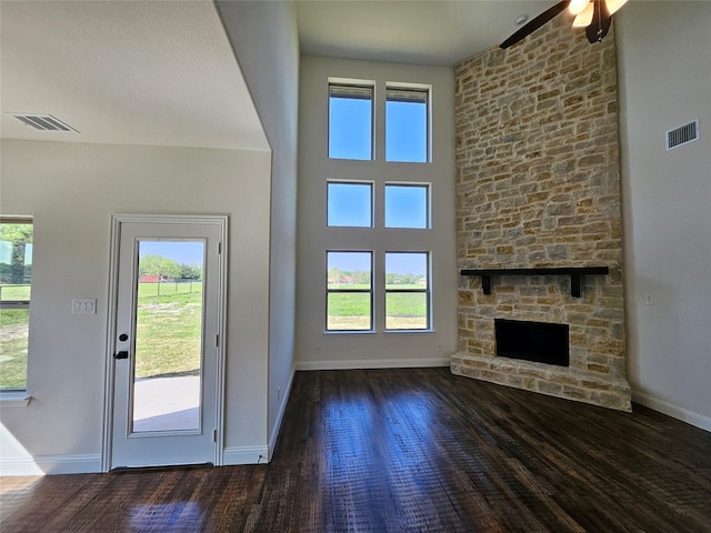 entryway with a healthy amount of sunlight, wood finished floors, and visible vents